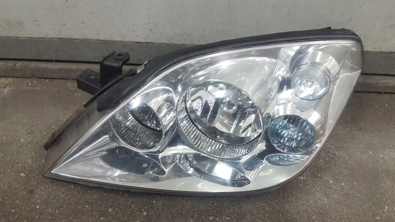 Nissan OE 606672135 фара передняя лева
