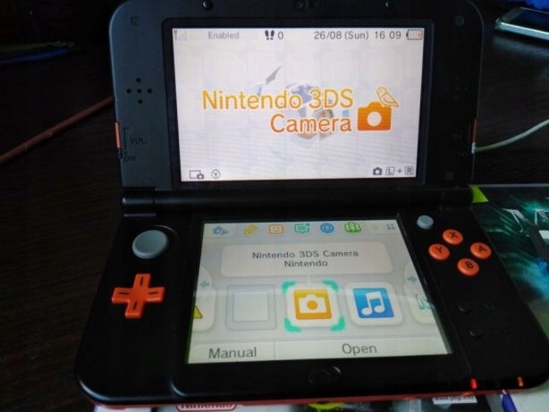 New Nintendo 3DS XL z grami i ładowarką